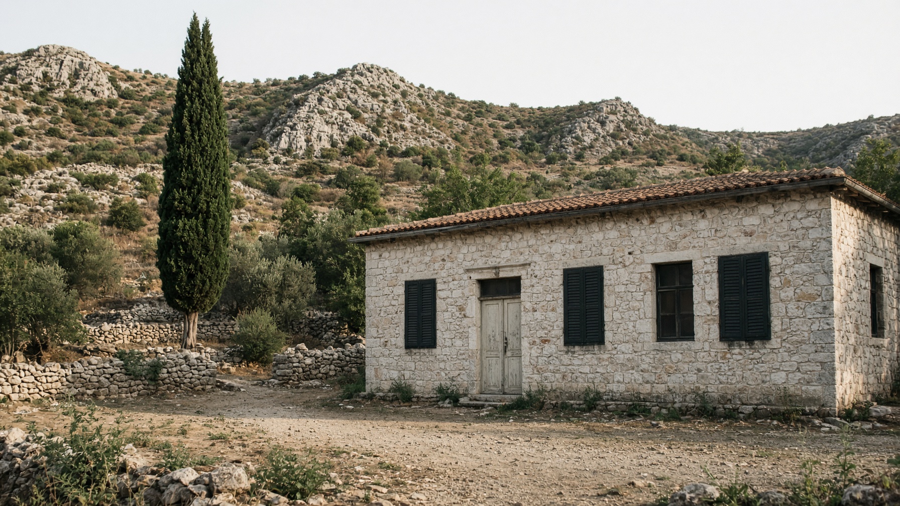 Stone school exterior in Herzegovina — sending-classroom geography, not a RecyclicTech handover